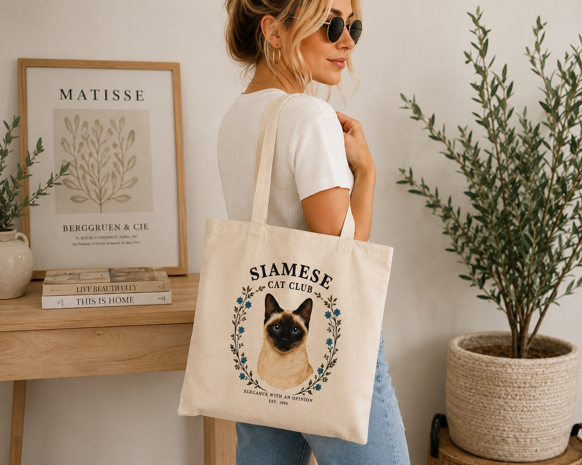 woman holding siamese cat club tote bag